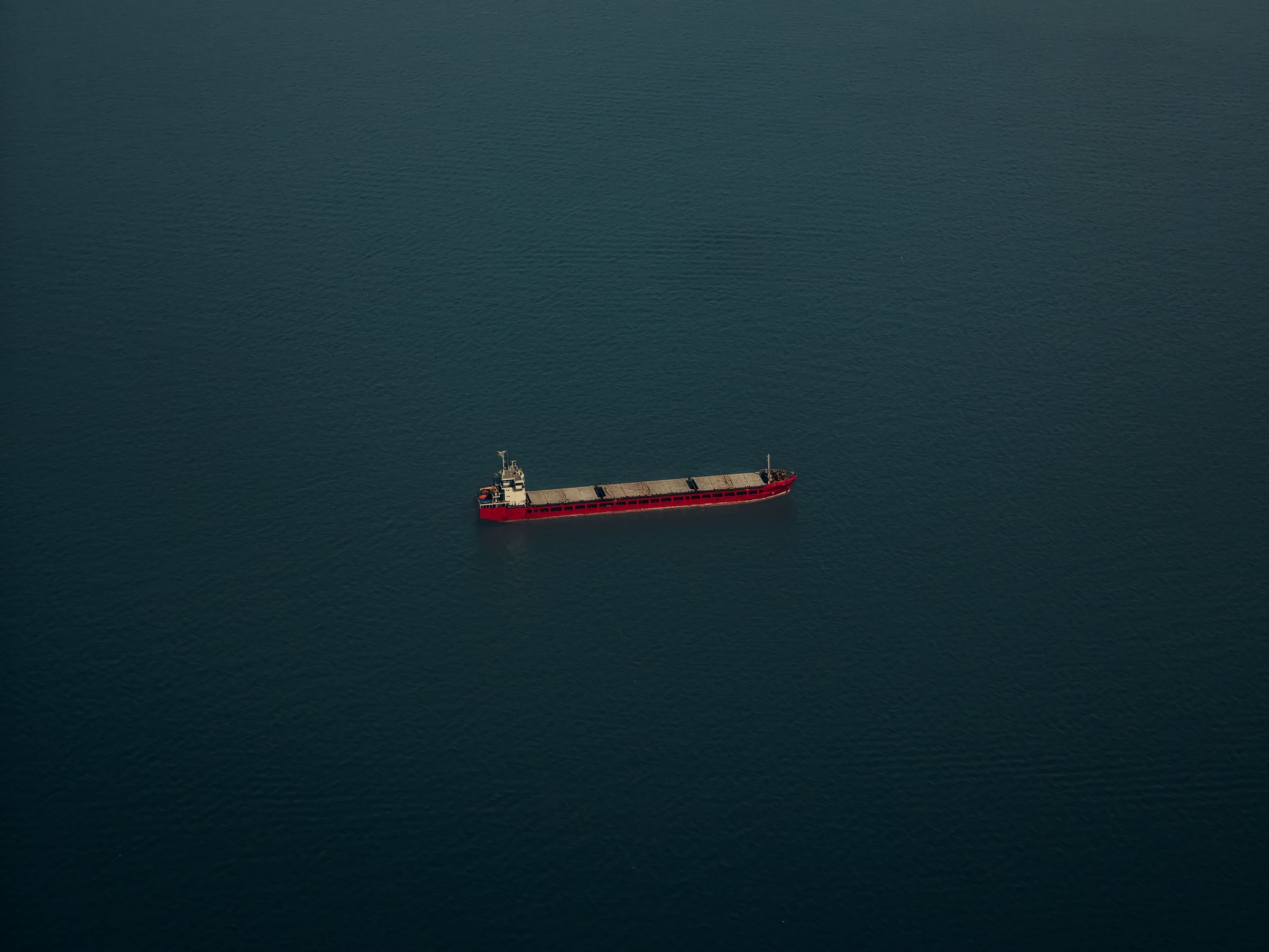 A single vessel on open water, seen from high above